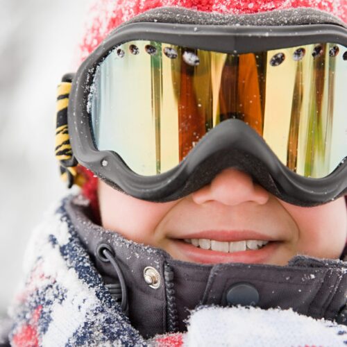 boy-wearing-ski-goggles-PE3YH9N-scaled